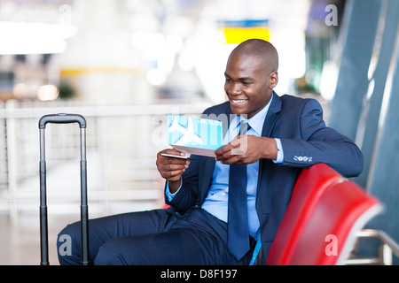 african businessman at airport waiting for flight Stock Photo