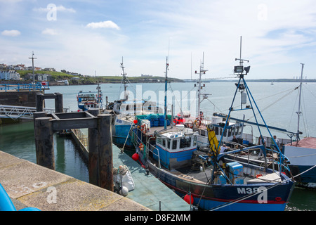 Fishing vessels moored outside the entrance to Milford Haven Port Stock Photo