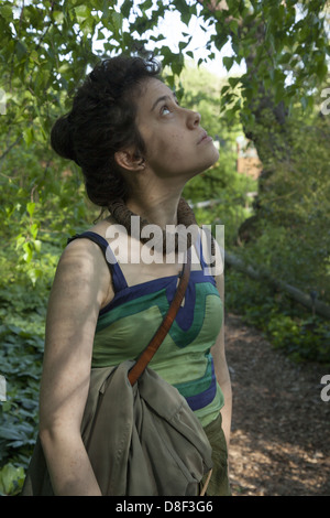 Young woman admires the natural surroundings at the Brooklyn Botanic Garden, Brooklyn, NY. Stock Photo