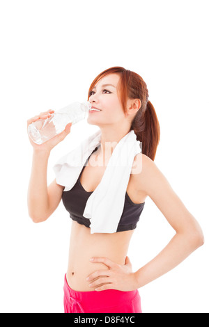 sporty young woman drinking water after workout Stock Photo
