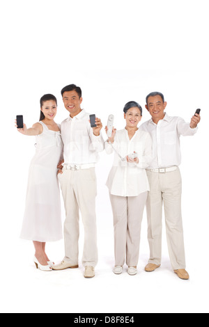 Whole family making phone call Stock Photo
