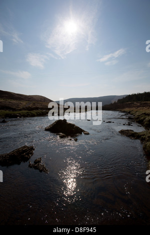 Oykel Bridge, Scotland. Picturesque silhouetted view of the River Oykel near Oykel Bridge in the background. Stock Photo