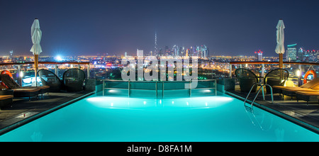 View of Dubai from the pool of Hilton Dubai Creek Hotel, UAE Stock Photo