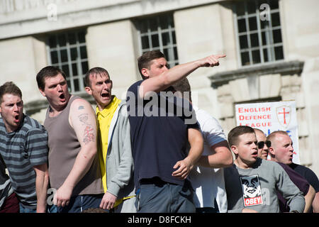 EDL supporters are shocked as anti-fascist demonstrators throw bottles at them during a rally outside Whitehall in London. The EDL rally was staged in support of UK troops in the aftermath of the murder of Drummer Lee Rigby. 27th May 2013. Copyright Stephen Ford/Alamy Live News