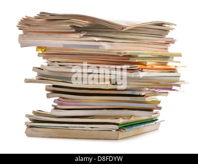 Stack of old magazines isolated on white. Paper recycling Stock Photo