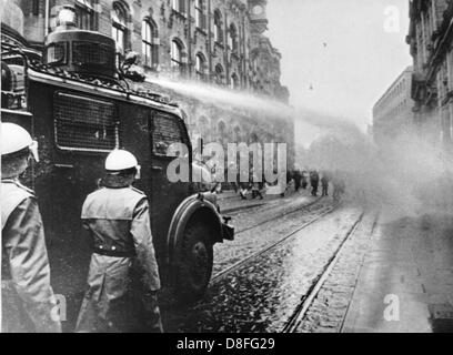 Police uses water guns against demonstrators in Bremen on the 12th of December in 1969. Stock Photo