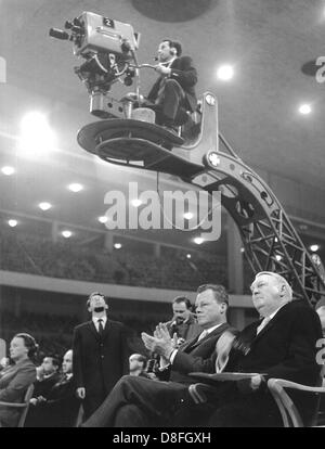 Federal minister of economy Prof. Ludwig Erhard (r) and governing mayor of Berlin Willy Brandt (2nd of left) applaude at the German radio, TV and phono exhibition in Berlin on the 24th of August in 1961. Stock Photo