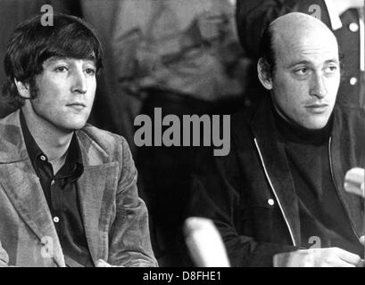 American director Richard Lester (r) and his actor John Lennon (l), known as one of the four Beatles, in September 1966 during a press conference in Hamburg. John Lennon acts in Lester's new film 'How I Won The War'. Stock Photo