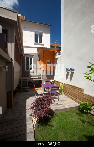 A small holiday house with its wooden extension (France). Petite maison de vacances avec une extension en bois (France). Stock Photo
