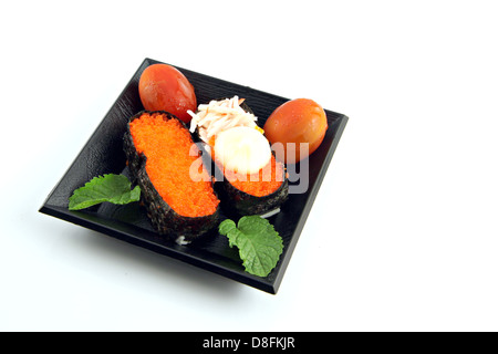 Sushi made from seafood and Place the tomatoes on the side,Sushi is a food of Japanese. Stock Photo