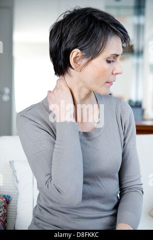 CERVICALGIA IN A WOMAN Stock Photo