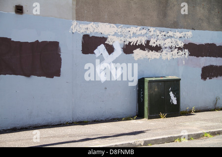 Swastika graffiti painted on wall Stock Photo