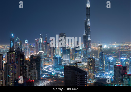 View of Business Bay and Burj Khalifa at night, Downtown Dubai, UAE Stock Photo