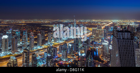 Buildings along Sheikh Zayed Road in Jumeirah Lakes Towers (JLT) Marina skyline high-angle shot night New Dubai UAE Stock Photo