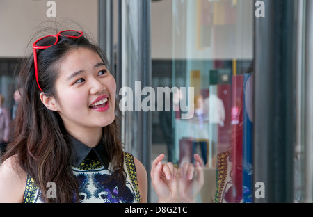 chinese woman shopping in london, england Stock Photo