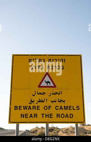 Road sign about loose camels on a way through the Negev desert,Israel Stock Photo