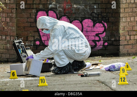 Belfast, Northern Ireland, UK. 28th May 2013.   Specialist Scene Of Crime Officers (SOCOs) gather evidence after two pipe bombs were thrown at PSNI officers attending a 999 call off the Crumlin Rd. Although shaken, the officers were uninjured. Credit:  Stephen Barnes / Alamy Live News