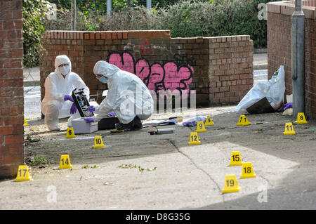 Belfast, Northern Ireland, UK. 28th May 2013.   Specialist Scene Of Crime Officers (SOCOs) gather evidence after two pipe bombs were thrown at PSNI officers attending a 999 call off the Crumlin Rd. Although shaken, the officers were uninjured. Credit:  Stephen Barnes / Alamy Live News Stock Photo