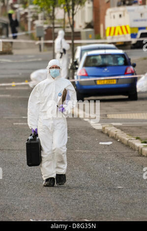Belfast, Northern Ireland, UK. 28th May 2013.   A Scene of Crime Officer leaves the scene where two pipe bombs were thrown at PSNI officers attending a 999 call off the Crumlin Rd. Although shaken, the officers were uninjured. Credit:  Stephen Barnes / Alamy Live News Stock Photo