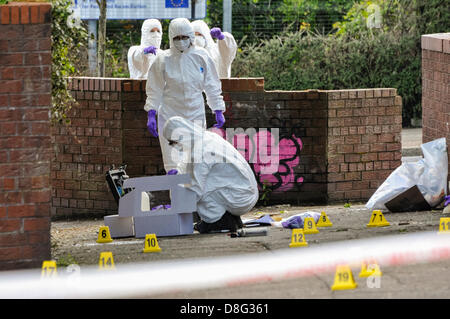 Belfast, Northern Ireland, UK. 28th May 2013.   Specialist Scene Of Crime Officers (SOCOs) gather evidence after two pipe bombs were thrown at PSNI officers attending a 999 call off the Crumlin Rd. Although shaken, the officers were uninjured. Credit:  Stephen Barnes / Alamy Live News