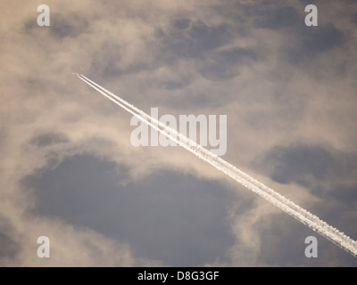 Vapour trails from a jet plane. Stock Photo
