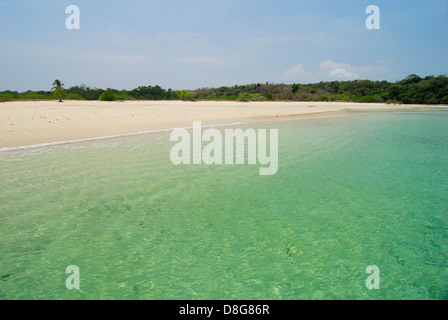Tropical beach with clear waters white sands and forest in Chapera island Stock Photo