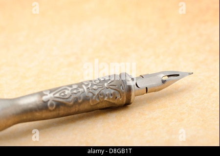 Feather quill an old paper Stock Photo