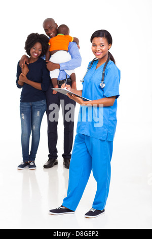 African American female nurse with young family on background Stock Photo