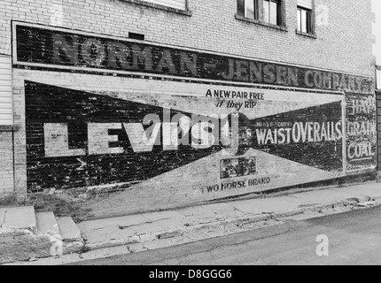 Old ad for the second ever JC Penny Store on the side of an old building in the historic mining town of Eureka, Utah. Stock Photo
