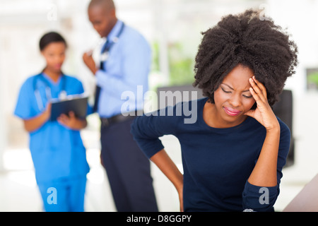 African female sick patient in doctor's office Stock Photo