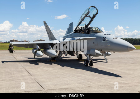 The McDonnell Douglas F/A-18 Hornet is a twin-engine supersonic, all-weather carrier-capable multirole combat jet. Stock Photo