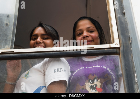 Brazilian school children on their way home from school. Stock Photo