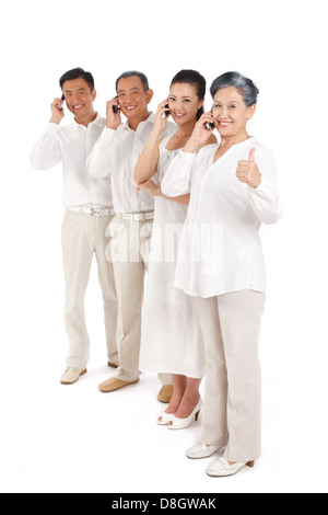 Young couple and old couple making phone call Stock Photo