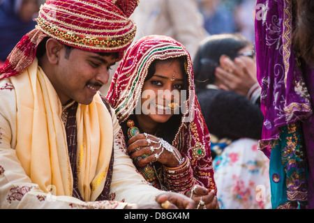 Newly married couple on a ghat next to the Ganges River in Varanasi, India Stock Photo