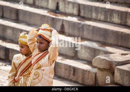 Boys from a traditional Hindu wedding ceremony on the Ganges in Varanasi, India Stock Photo