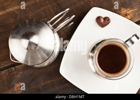 Elegant Coffee Cup Served Along With Filter Against Heavy Polished Wood Table Stock Photo