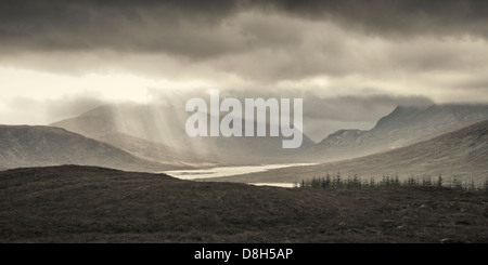 Sun rays pass through cloud cover, Highlands, Scotland, United Kingdom Stock Photo
