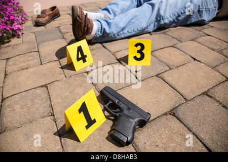 Crime Scene With Handgun Casings, Evidence Markers And Blood On ...