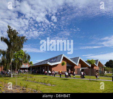 The Winchcombe School, Newbury, United Kingdom. Architect: Architype Limited, 2012. View across school garden to building with a Stock Photo