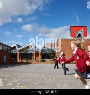 The Winchcombe School, Newbury, United Kingdom. Architect: Architype Limited, 2012. Schoolyard with children at play. Stock Photo