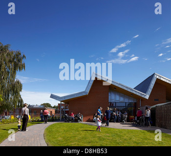 The Winchcombe School, Newbury, United Kingdom. Architect: Architype Limited, 2012. View across school garden to building with a Stock Photo