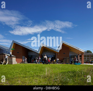 The Winchcombe School, Newbury, United Kingdom. Architect: Architype Limited, 2012. View across school garden to building with a Stock Photo