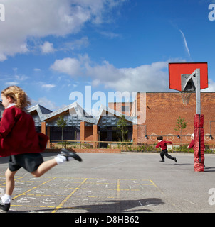 The Winchcombe School, Newbury, United Kingdom. Architect: Architype Limited, 2012. Schoolyard with children at play. Stock Photo