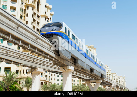Overhead monorail railway transporting passengers to The Atlantis Hotel on The Palm Jumeirah island in Dubai United Arab Emirate Stock Photo