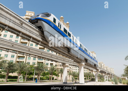 Overhead monorail railway transporting passengers to The Atlantis Hotel on The Palm Jumeirah island, Dubai United Arab Emirates Stock Photo