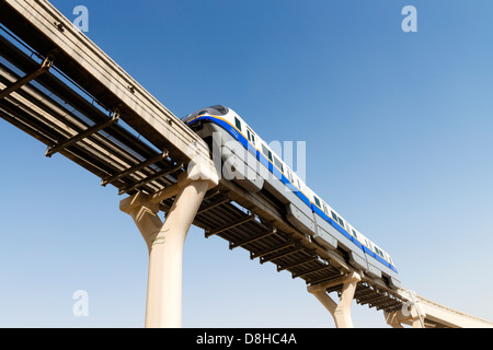 Overhead monorail railway transporting passengers to The Atlantis Hotel on The Palm Jumeirah island in Dubai United Arab Emirate Stock Photo