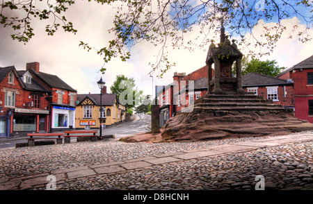 The Cross, Lymm in spring, showing cobbled area and square, Warrington, Cheshire, England, UK Stock Photo