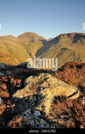 View towards Great Gable and Kirk Fell from Haystacks in evening sunlight in the English Lake District Stock Photo