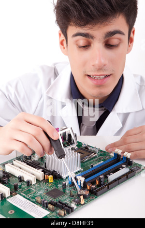 Computer engineer working on an old motherboard Stock Photo