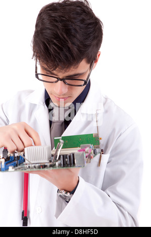 Computer engineer working on an old motherboard Stock Photo